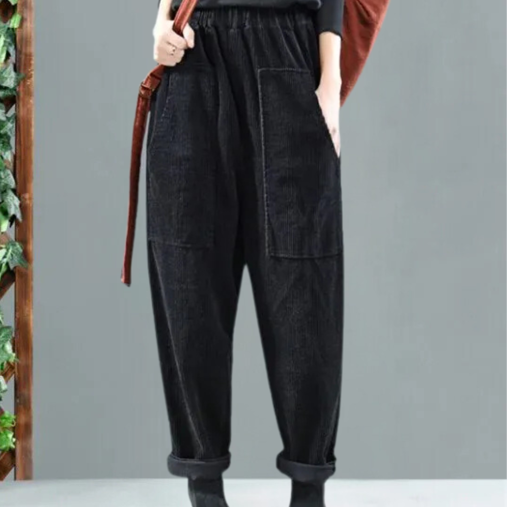 Damenhose aus schwarzem Denim mit elastischem Bund und großen Taschen, lässiger Stil.