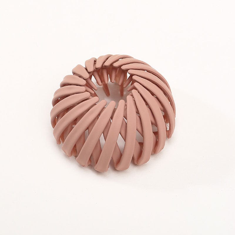 Einzelne matte Klammer in gedecktem Rosa, die Streben winden sich spiralförmig um die Öffnung. 7