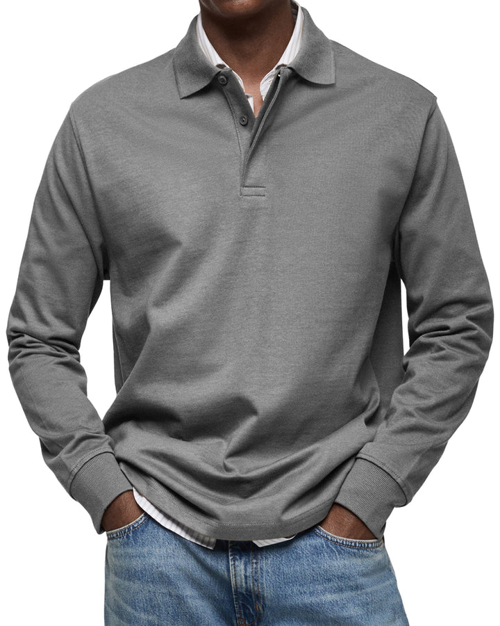 Langarm-Poloshirt in mittlerem Grau, am Model getragen, mit Polokragen, Knopfleiste und Rippbündchen. 6