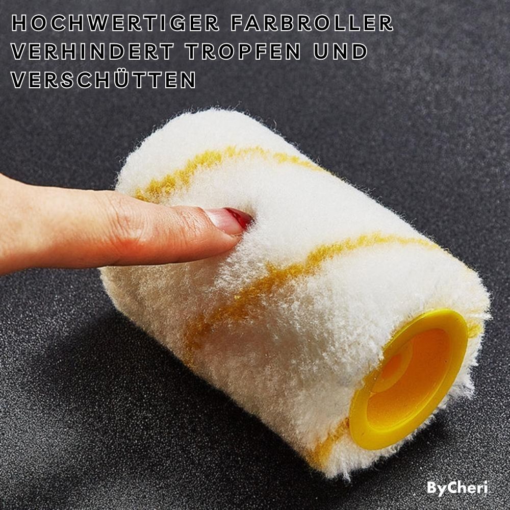 Weiße Ersatzrolle mit gelben Streifen und gelber Kappe liegt auf dunklem Untergrund, ein Finger drückt in den weichen Flor. 7