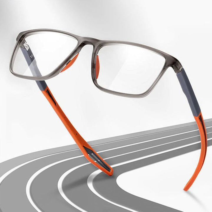 Brille mit grauem Rahmen und orangefarbenen Bügeln schwebt schräg vor einem Hintergrund mit geschwungener Rennbahn-Grafik. 8