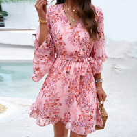 Playful mini dress with floral pattern & bell sleeves – Liora