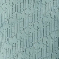 Hellblauer Stoff mit eingewebtem, wiederholtem CH-Logo-Muster, elegant und modern.
