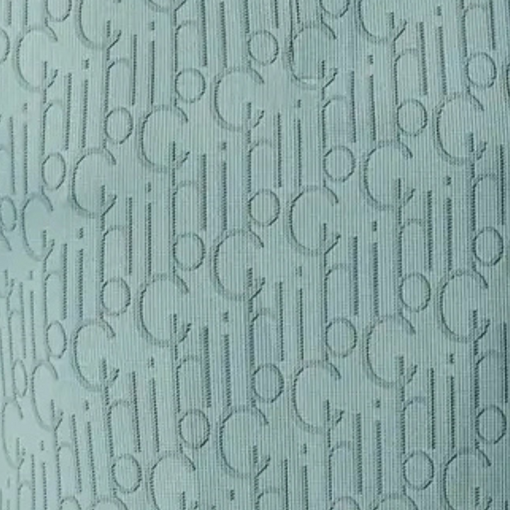 Hellblauer Stoff mit eingewebtem, wiederholtem CH-Logo-Muster, elegant und modern.