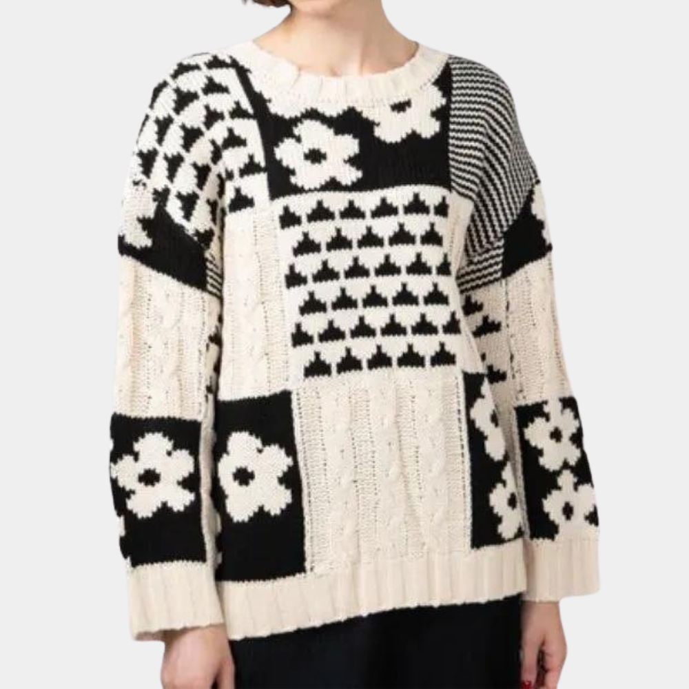 Schwarz-weißer Damenpullover mit Blumenmuster, Strickdesign, langärmelig, modisch.