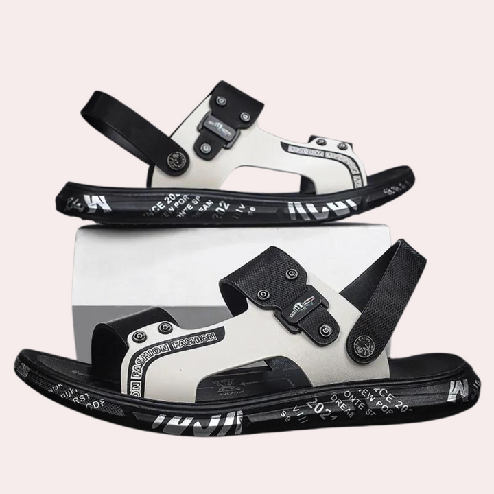 Schwarze und weiße Sandalen mit Schnallen, modisches Design, Unisex-Sommerschuhe.