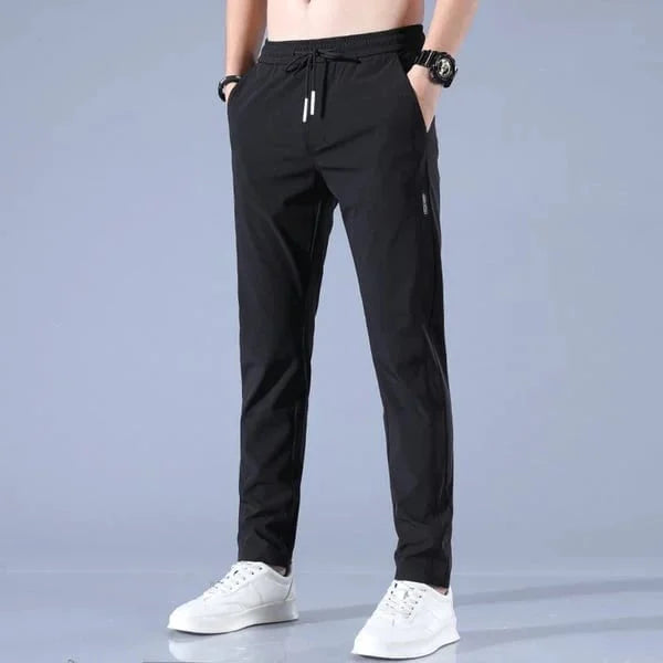 Modelos nuevos 2025 Pantalones elásticos de secado rápido unisex