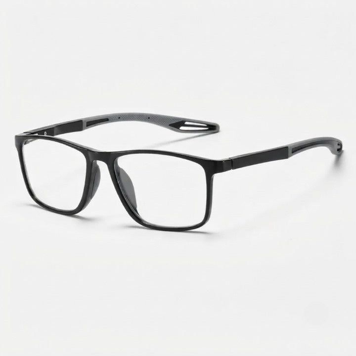 Brille mit schwarzem Rahmen und grauen Bügelenden mit Aussparung, schräg von vorne vor hellem Hintergrund. 6