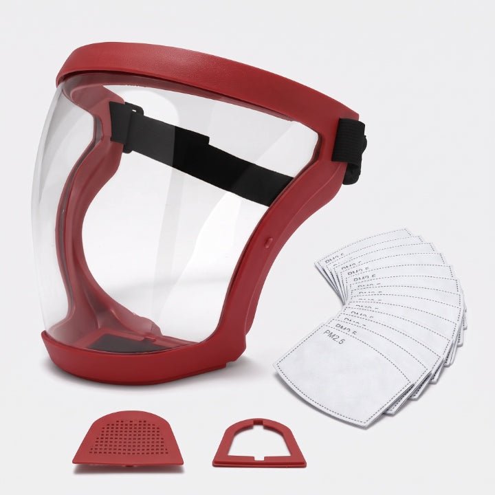 Rote Vollgesichtsmaske mit klarem Visier und schwarzem Kopfband, daneben aufgefächerte Ersatzfilter und zwei rote Filterhalterungen. 7
