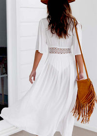 Long beach dress with lace accents and bow closure – Elara