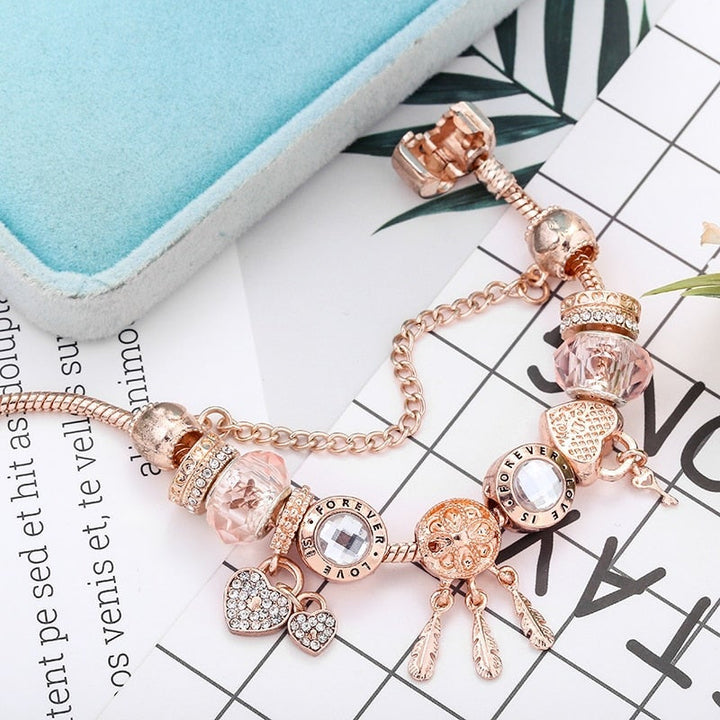 Pulsera atrapasueños rosa con charms de plata de ley
