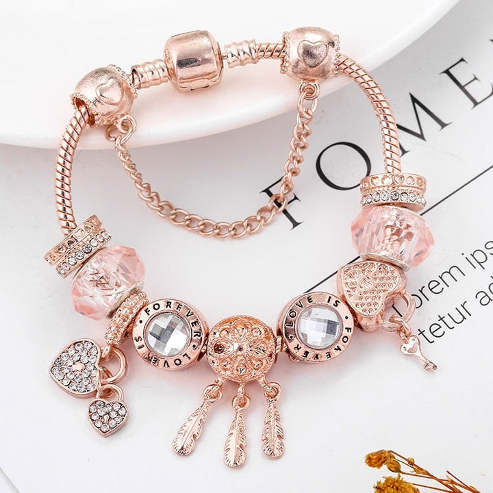 Pulsera atrapasueños rosa con charms de plata de ley