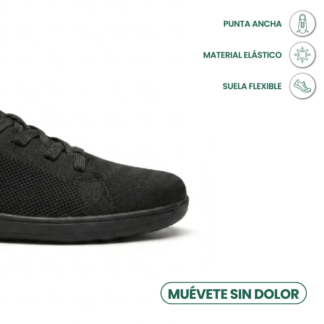 Schwarzer Sneaker, Zehenpartie im Ausschnitt, mit Symbolen für breite Spitze, elastisches Material und flexible Sohle. 14