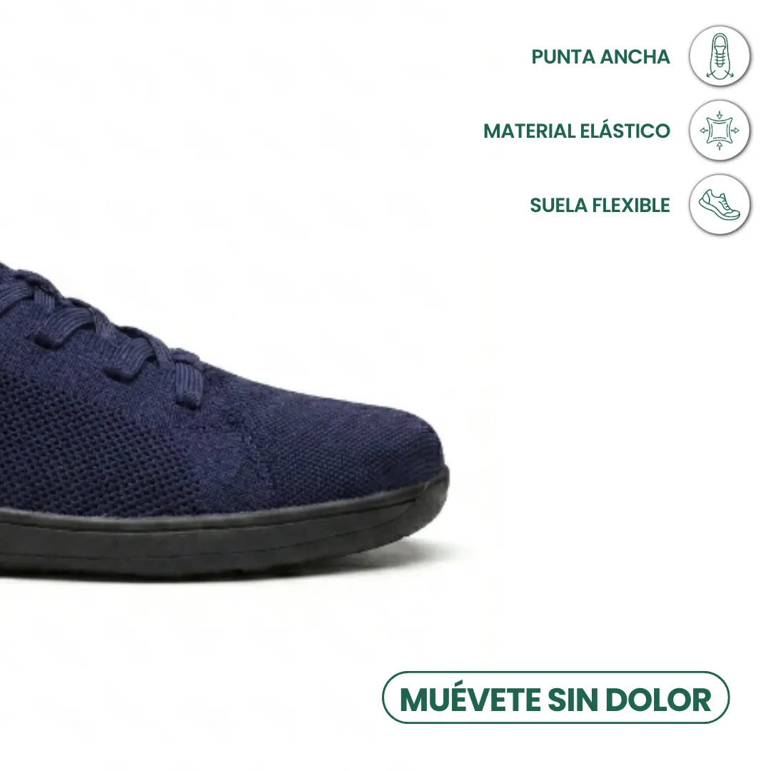 Detailansicht der breiten Zehenbox eines marineblauen Mesh-Sneakers mit schwarzer Sohle, daneben Symbole für flexible Sohle und dehnbares Material. 23