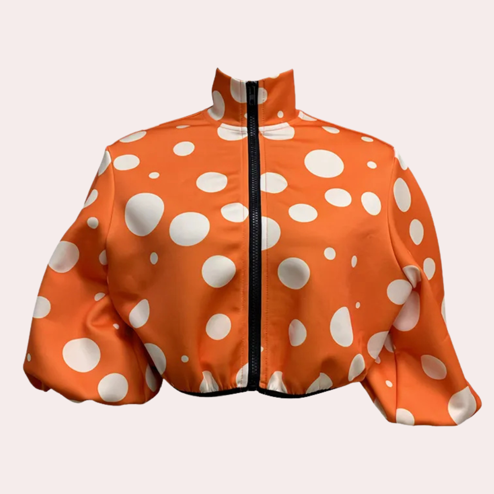 Orange Jacke mit weißen Punkten, Reißverschluss, modisch, Damenbekleidung, auffälliges Design.