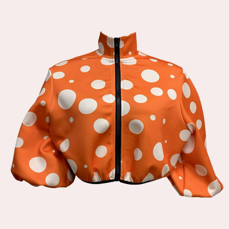 Orange Jacke mit weißen Punkten, Reißverschluss, modisch, Damenbekleidung, auffälliges Design.
