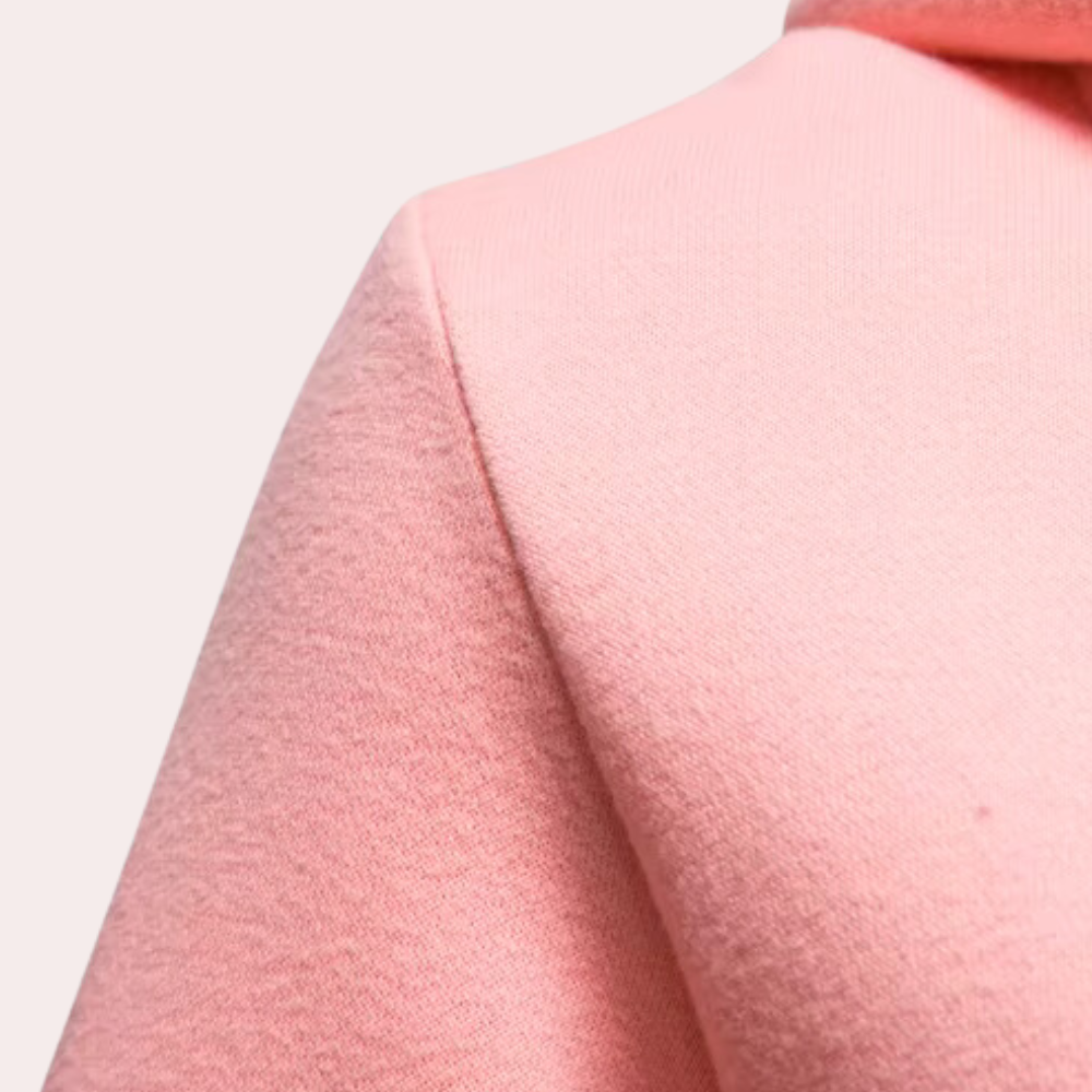 Rosa Wollmantel Damen, elegantes Design, weiches Material, Herbstmode, Nahaufnahme.