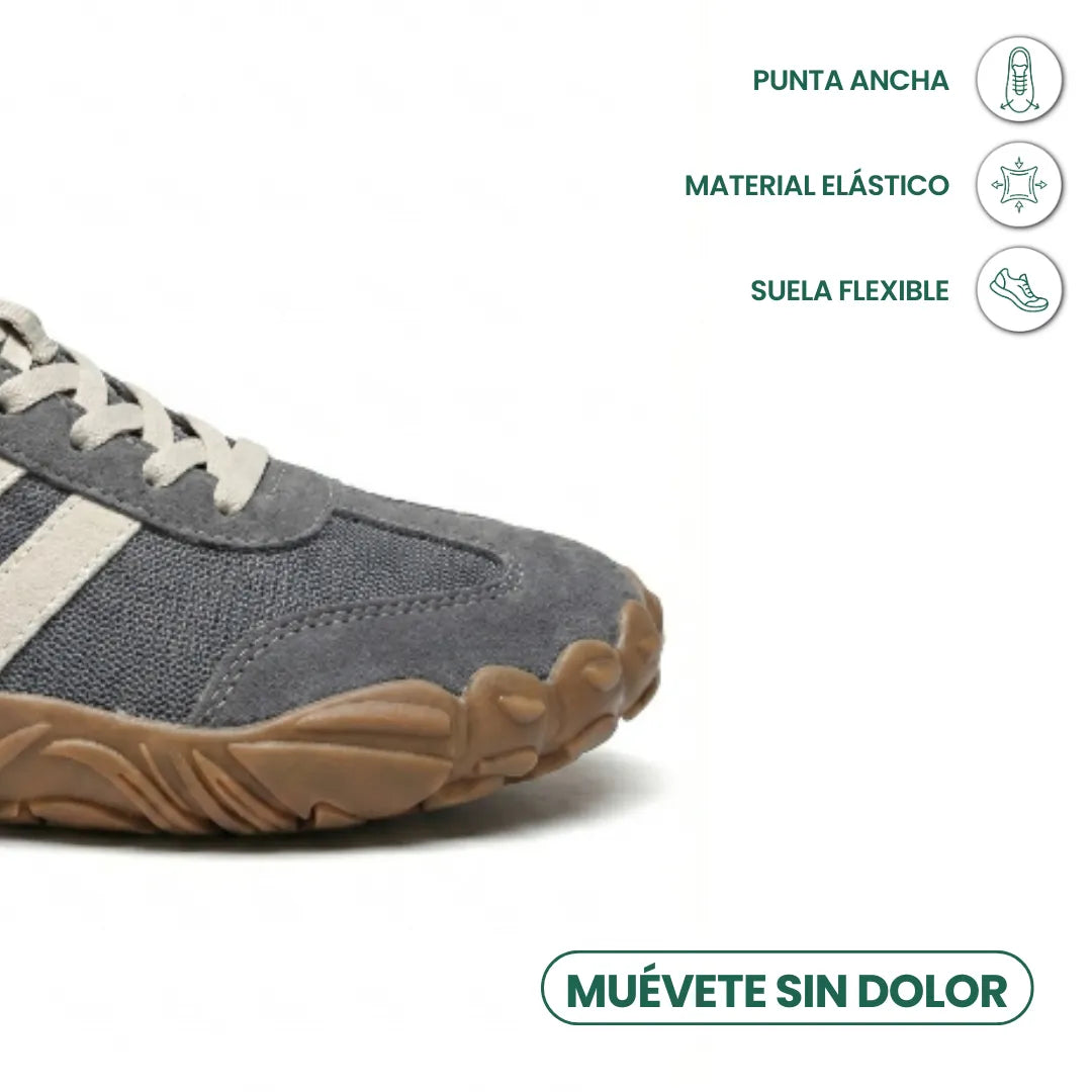 Vorderfuß des grauen Barfußschuhs im Detail, mit Symbolen für breite Zehenbox, elastisches Material und flexible Sohle. 5