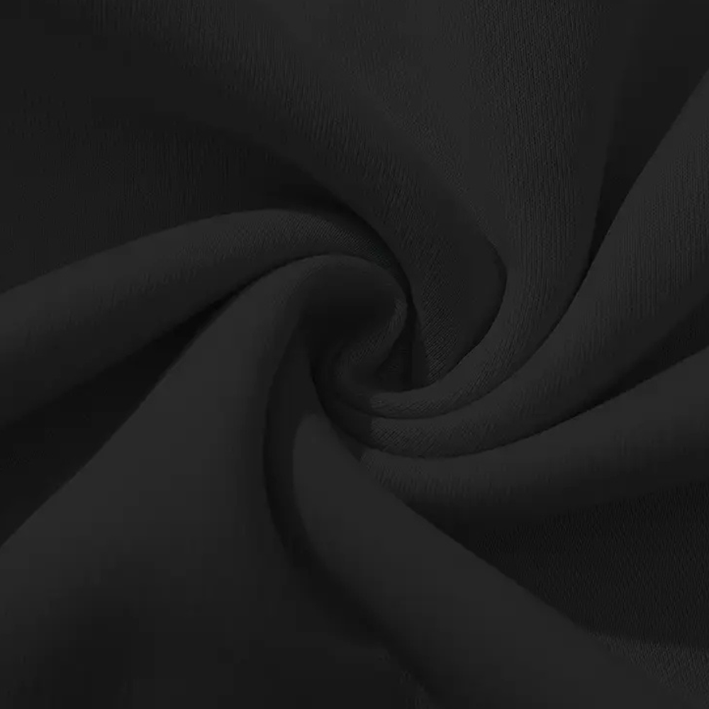 Schwarzer Baumwollstoff, Nahaufnahme, weiche Textur, ideal für Bekleidung und Heimtextilien.