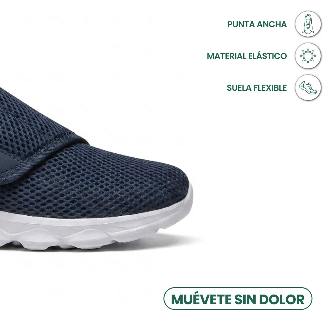Nahaufnahme der breiten Schuhspitze des marineblauen Netzschuhs, daneben Symbole für weiche Spitze, elastisches Material und flexible Sohle. 5
