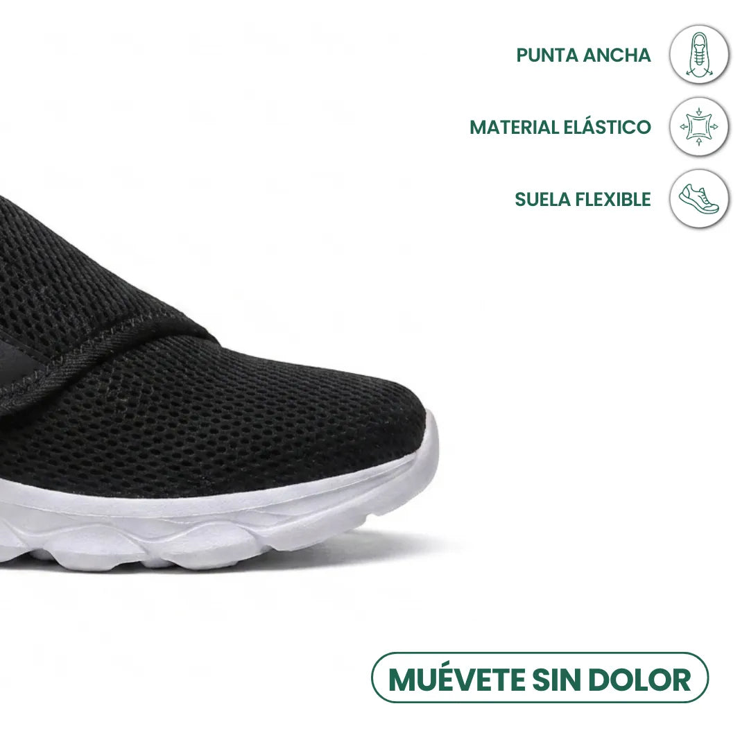 Vorderer Teil des schwarzen Mesh-Schuhs mit weißer Sohle, Symbole nennen breite Spitze, elastisches Material und flexible Sohle. 23
