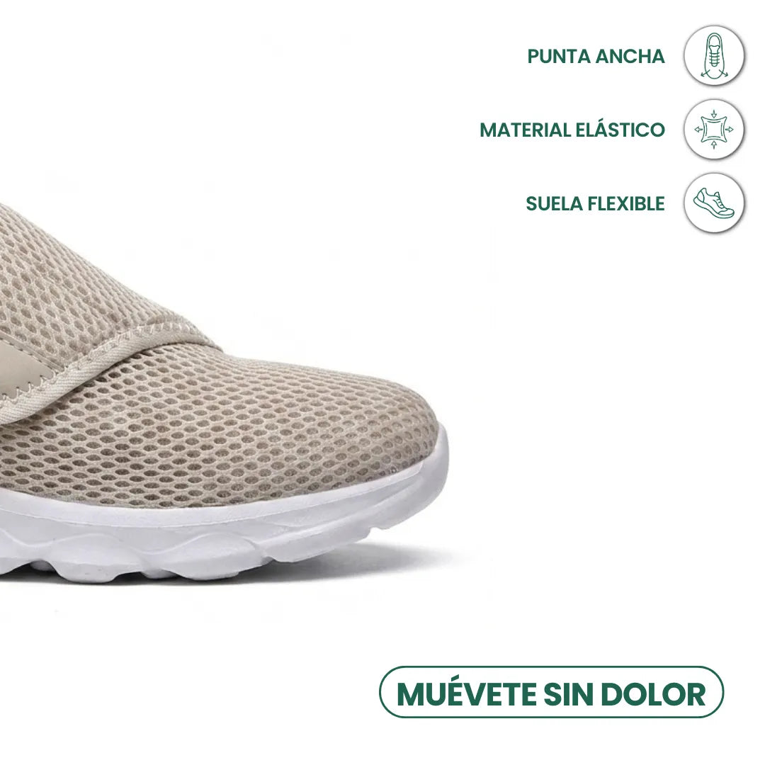 Vorderer Teil des beigen Mesh-Schuhs mit weißer Sohle, Symbole nennen breite Spitze, elastisches Material und flexible Sohle. 32