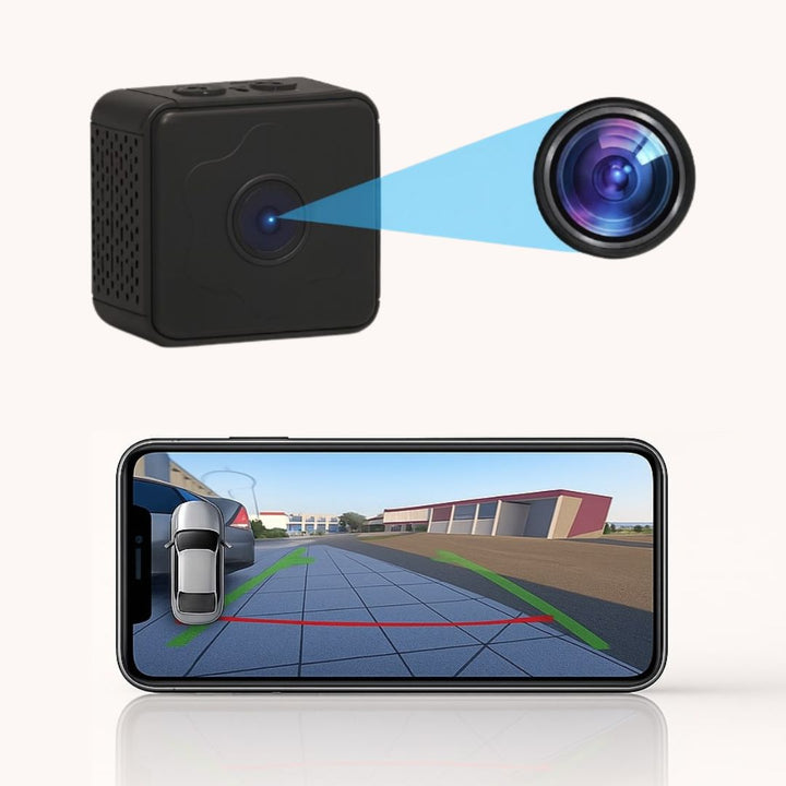 Schwarze würfelförmige Kamera mit vergrößerter Linse und Smartphone, das eine Rückfahransicht mit grünen und roten Hilfslinien zeigt. 2