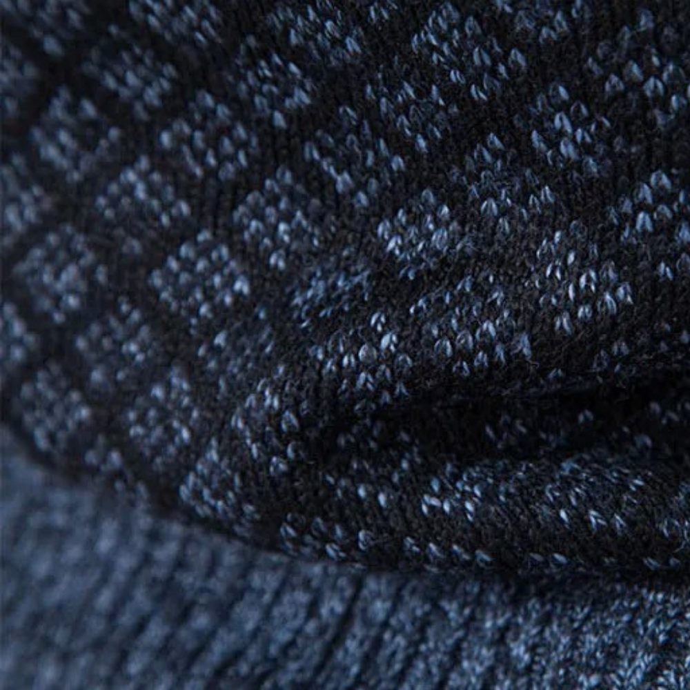 Dunkelblauer Strickstoff mit Rautenmuster, Textil, Mode, Detailansicht, Textur.