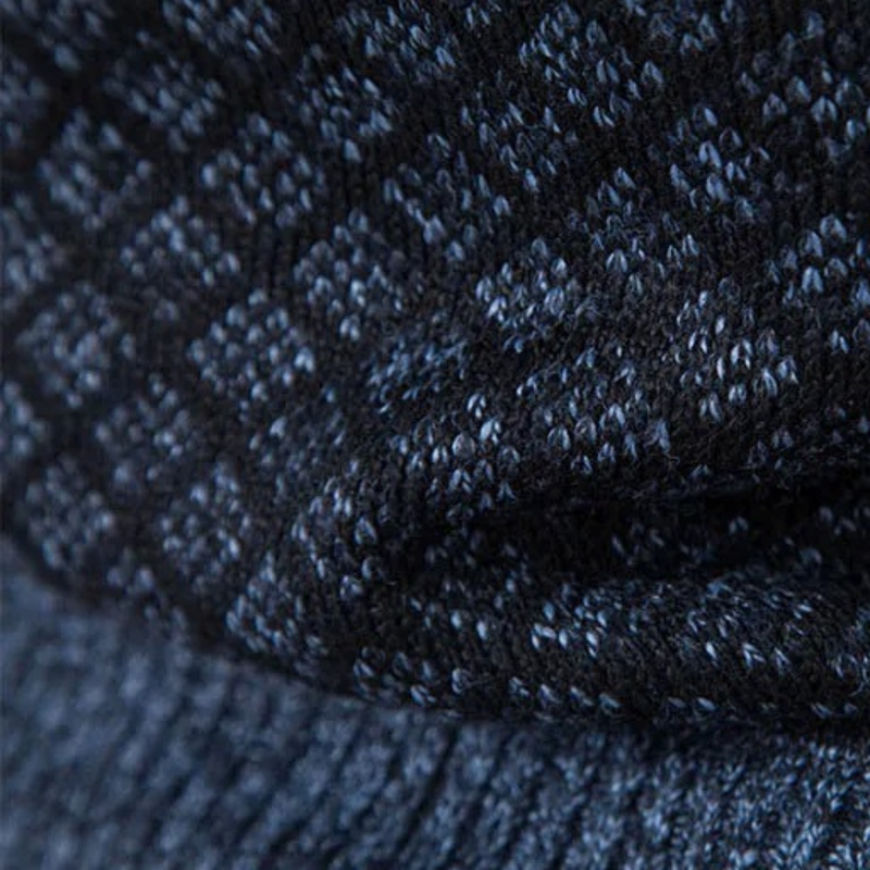 Dunkelblauer Strickstoff mit Rautenmuster, Textil, Mode, Detailansicht, Textur.