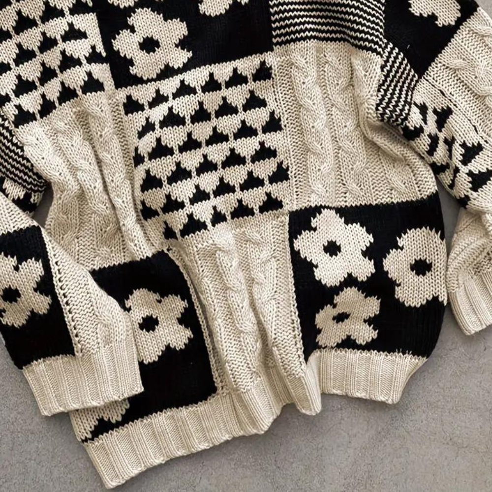 Schwarz-weißer Strickpullover mit geometrischem und Blumenmuster, grob gestrickt, Unisex-Design.