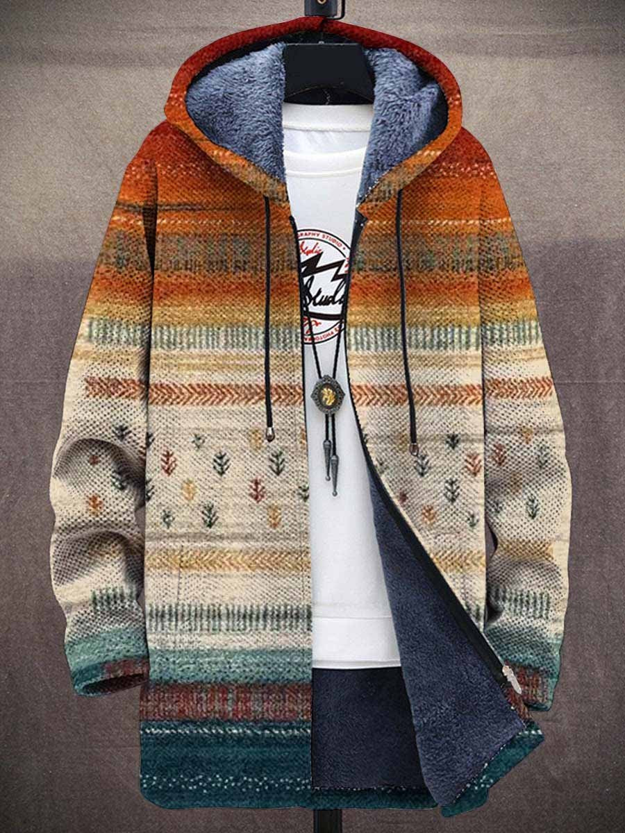 Vorderansicht der offenen Kapuzenjacke mit blauem Plüschfutter, gestreiftem Farbverlauf von Orange zu Petrol und kleinen 1