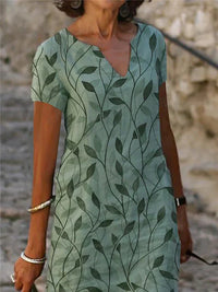 Bezauberndes Kleid mit zauberhaftem Design in Smaragdgrün - GrüneAura
