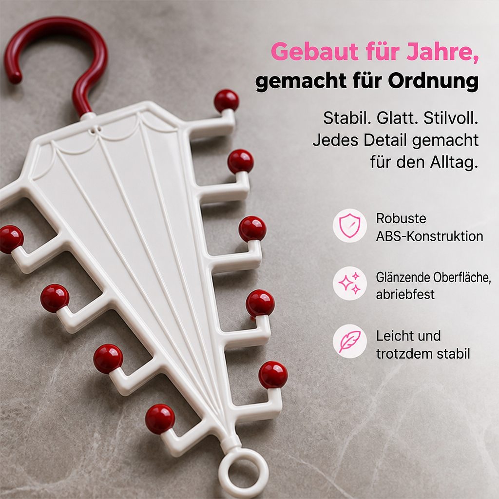 Nahaufnahme eines weißen Halters mit roten Kugelenden auf Steinuntergrund, glänzende Kunststoffoberfläche gut erkennbar 3