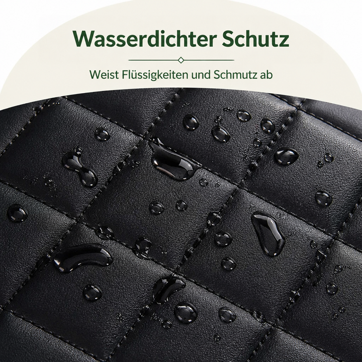 Nahaufnahme der schwarzen Steppoberfläche mit Wassertropfen, die auf dem glatten Material abperlen und die wasserabweisende Wirkung zeigen. 3