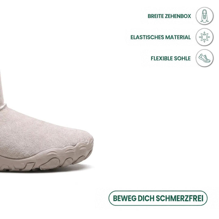 Nahaufnahme der breiten Spitze des hellgrauen Stiefels mit flexibler Sohle und Symbolen für Zehenfreiheit und Elastizität 32