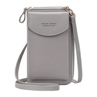 Compact shoulder bag made of PU leather with adjustable strap