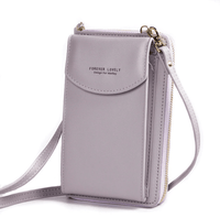 Compact shoulder bag made of PU leather with adjustable strap