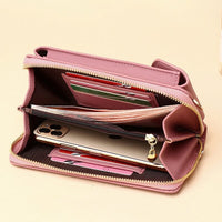 Compact shoulder bag made of PU leather with adjustable strap
