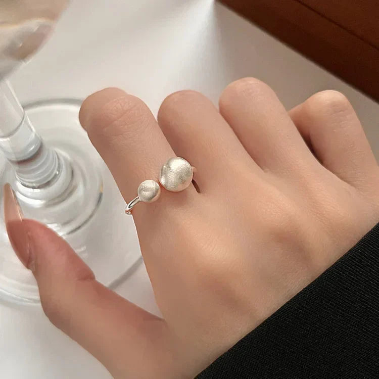 Brushed Silver Ring with Connected Pearls – Elara