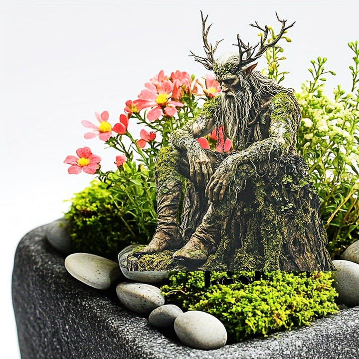 Waldgeist mit Geweih zwischen rosa Blumen, Moos und glatten Kieselsteinen in einer grauen Pflanzschale. 9