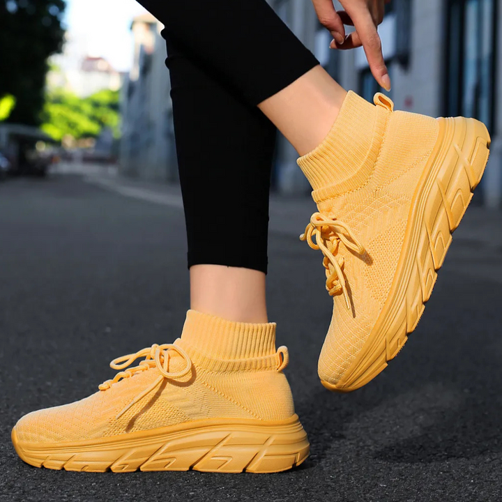 Gelbe Damen-Sneaker, atmungsaktiv, Strickmaterial, ideal für Freizeit und Sport.