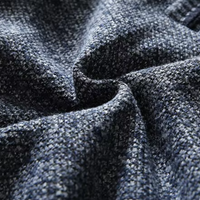 Dunkelblauer Strickstoff, grob gewebt, Nahaufnahme, Textur, Mode, Bekleidungsmaterial.