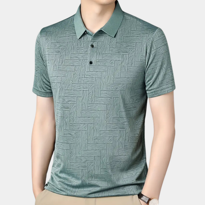 Grünes Herren-Poloshirt mit geometrischem Muster, kurzärmelig, aus Baumwolle.