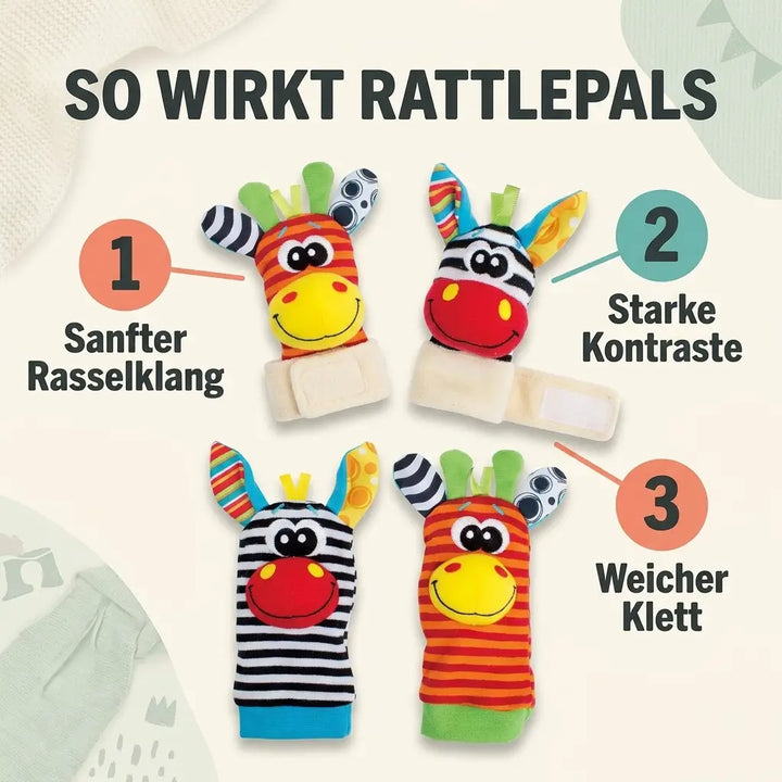 Zwei Handgelenkrasseln mit Klettband und zwei Rasselsocken mit Zebra- und Giraffengesicht nebeneinander, mit nummerierten Hinweisen zu den Eigenschaften. 5