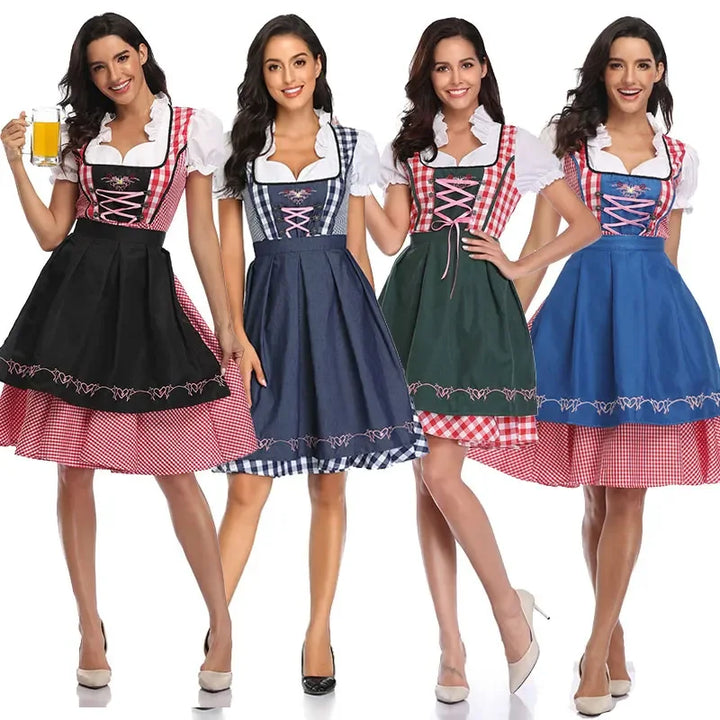 Vier Frauen nebeneinander tragen das Dirndl-Set in vier Varianten: mit schwarzer, marineblauer, grüner und blauer Schürze. 10