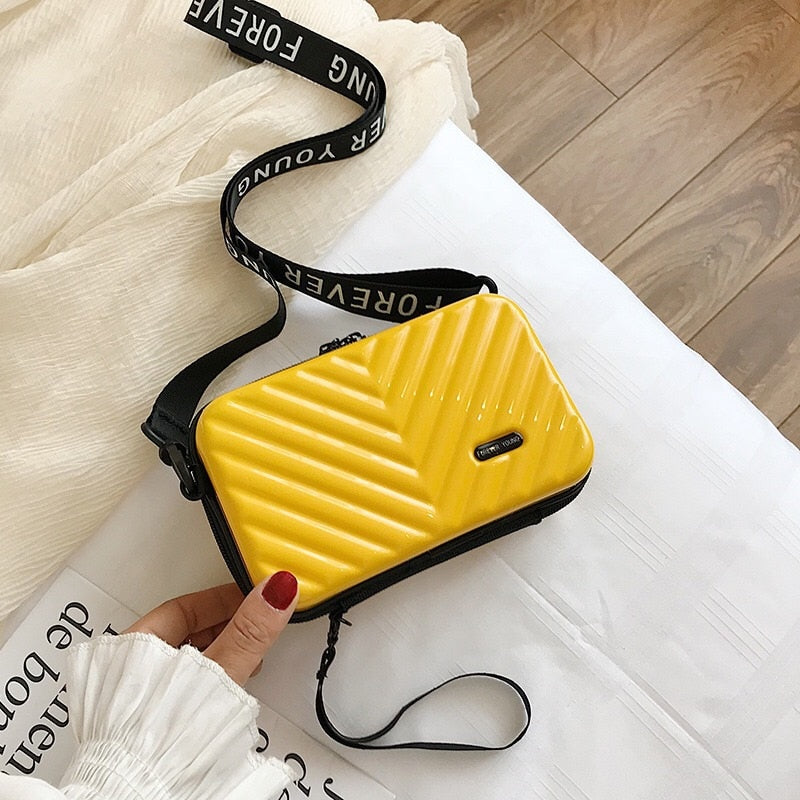Compact hard-shell travel handbag