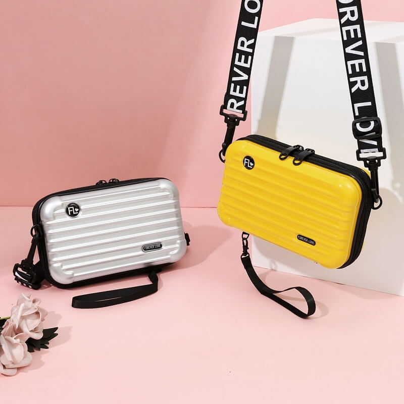 Compact hard-shell travel handbag