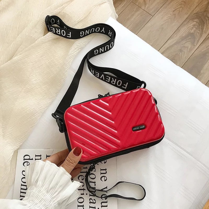 Compact hard-shell travel handbag