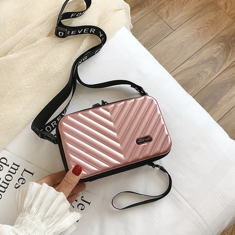 Compact hard-shell travel handbag