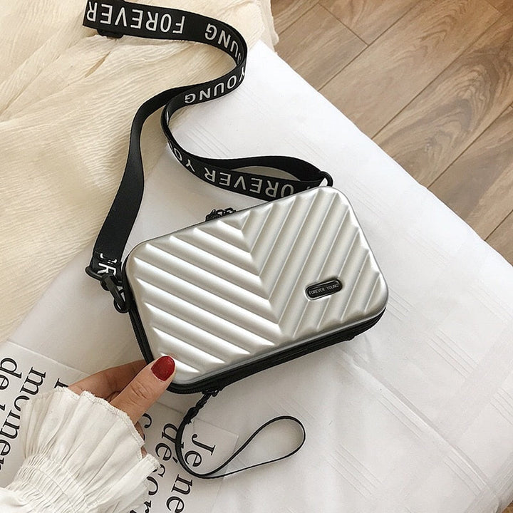 Compact hard-shell travel handbag